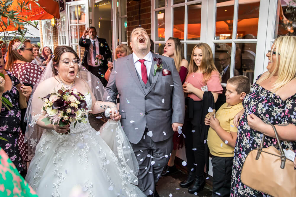 Bride & groom, confetti, wedding.